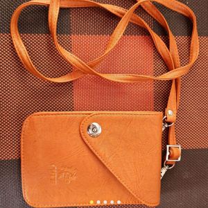combo  of sling bag and book