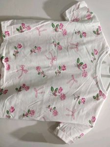A Crop Top With Bows On It
