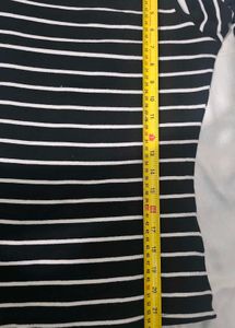 H&amp;M  Black and white striped cold-shoulder top.