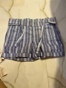 combo of white ribbed shirt and cotton shorts