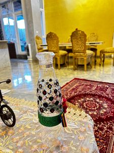 Crystallized designer plastic bottle