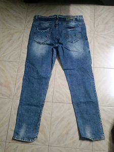 Distressed Blue Denim Jeans