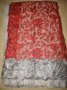 Red fancy saree worth 2K