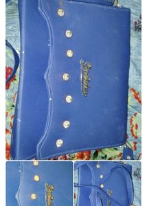 Blue Silling Bag With Matching Earrings.