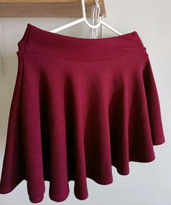 Flared mini skirt in maroon colour