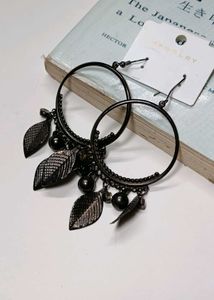 A Pair Of Black Hoop earrings