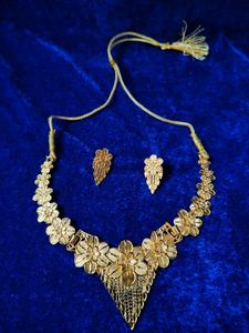 Golden necklace set.