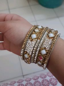 Stone Bangles Of White And Golden Color.