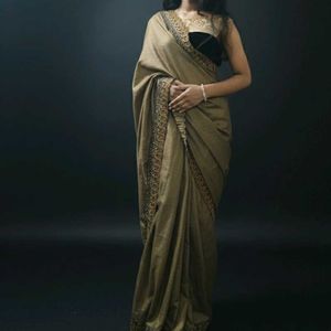 Elegant Brown Saree with Intricate Border