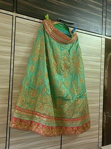 EMBELLISHED SILK LEHENGA IN PINK GREEN AND GOLDEN
