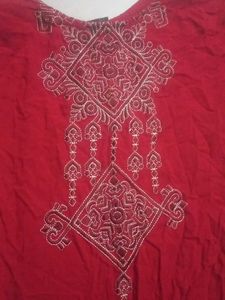 A red long size straight kurti