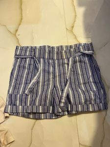 combo of white ribbed shirt and cotton shorts