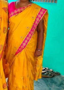 Yellow Silk Saree with Pink Embroidered Border