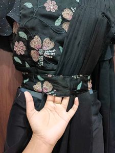 Elegant Black Saree with Floral Details And Belt