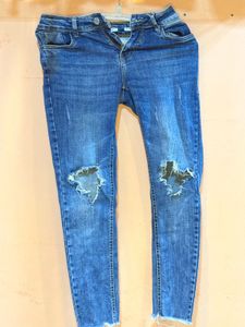 Ripped Knee Jeans