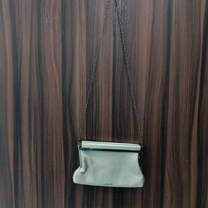 NWT Embelle Gold Cluth With Black Metal Sling