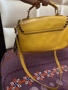 at half rate now mustard hand bag