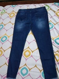Ripped Knee Skinny Jeans