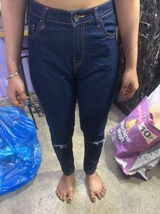 Ripped Knee Jeans