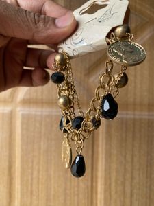 Gold Tone Coin and Bead Charm Bracelet