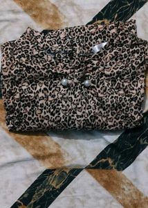 leopard-print top with pearl buttons