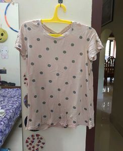 Nude color tshirt with sliver patch work.