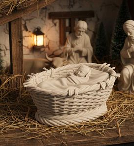 Cradle with baby Jesus for nativity scene