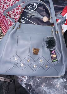 Stylish Blue Handbag with Charm