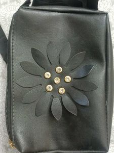 Stylish Black Sling Bag with Floral Cut Design