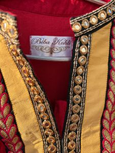 Red Embroidered Kurti With Salwar And Dupatta.