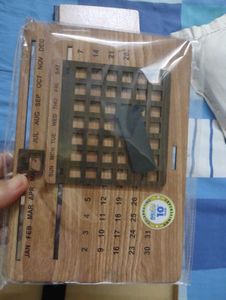 Absolutely new Wooden  Calendar ,pen and a woode