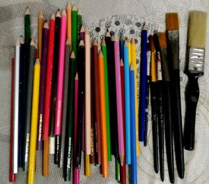 Colour Pencils And Paint Brushes