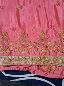It Is Pink Color Georget With Golden Net Border .