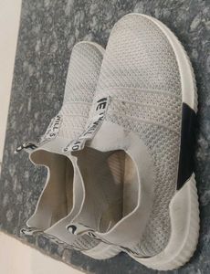 Worn White Casual Shoes