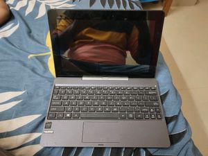 Asus mini windows touch laptop bacome Tab
