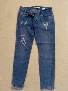 Ripped Blue Denim Jeans