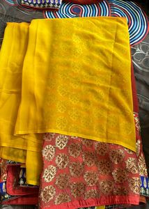 YELLOW ORANGE SHIFFON AND HEAVY EMBROIDERY SAREE