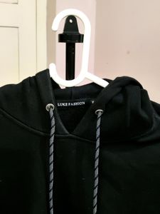 💥BUY1GET1💥 black hooded sweatshirt with white stripes on the sleeves.