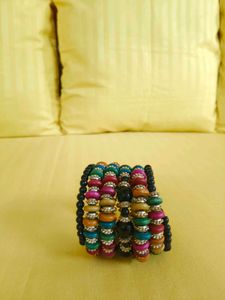 This is a colorful boho-style beaded bracelet stac