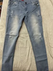 Distressed Light Grey Slim-Fit Jeans – Edgy & Chic