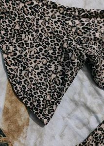 leopard-print top with pearl buttons