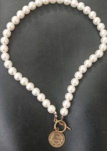 Pearl Necklace w/ Coin Pendant
