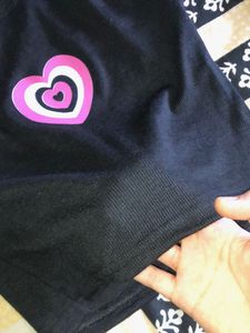Black no sleeves crop top.