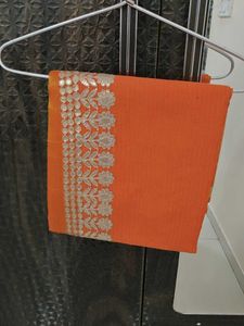 Orange saree with silver embroidery