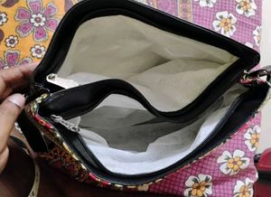 Multicolored Printed Black Faux Leather Sling Bag