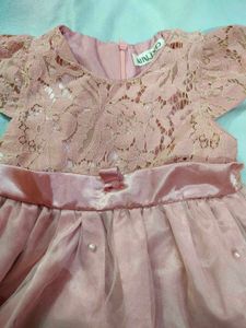 A Used Baby Girl Peach Color Frock