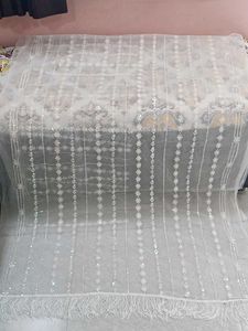 Elegant Embroidered Net Fabric with Fringe