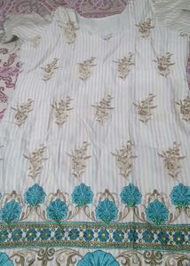 Elegant Embroidered Kurta in firozi colour