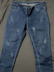 Distressed Blue Denim Jeans