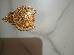 Gold Tone Pendant With Intricate Woven Texture